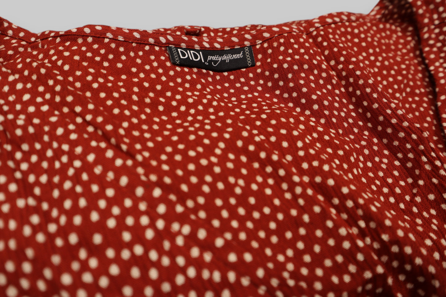 DIDI “Pretty Different” Maxi Dress – Burnt Orange with White Dot Print