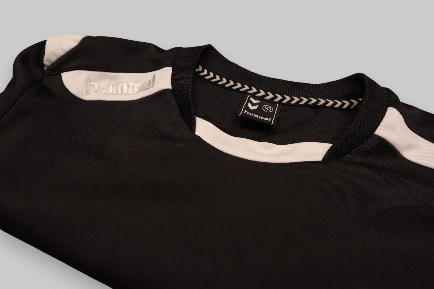 Hummel Youth Long-Sleeve Sports Top – Black with White Accents (Size 140)